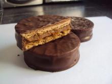 Cookies filled with  milk   caramel  spread covered with chocolate